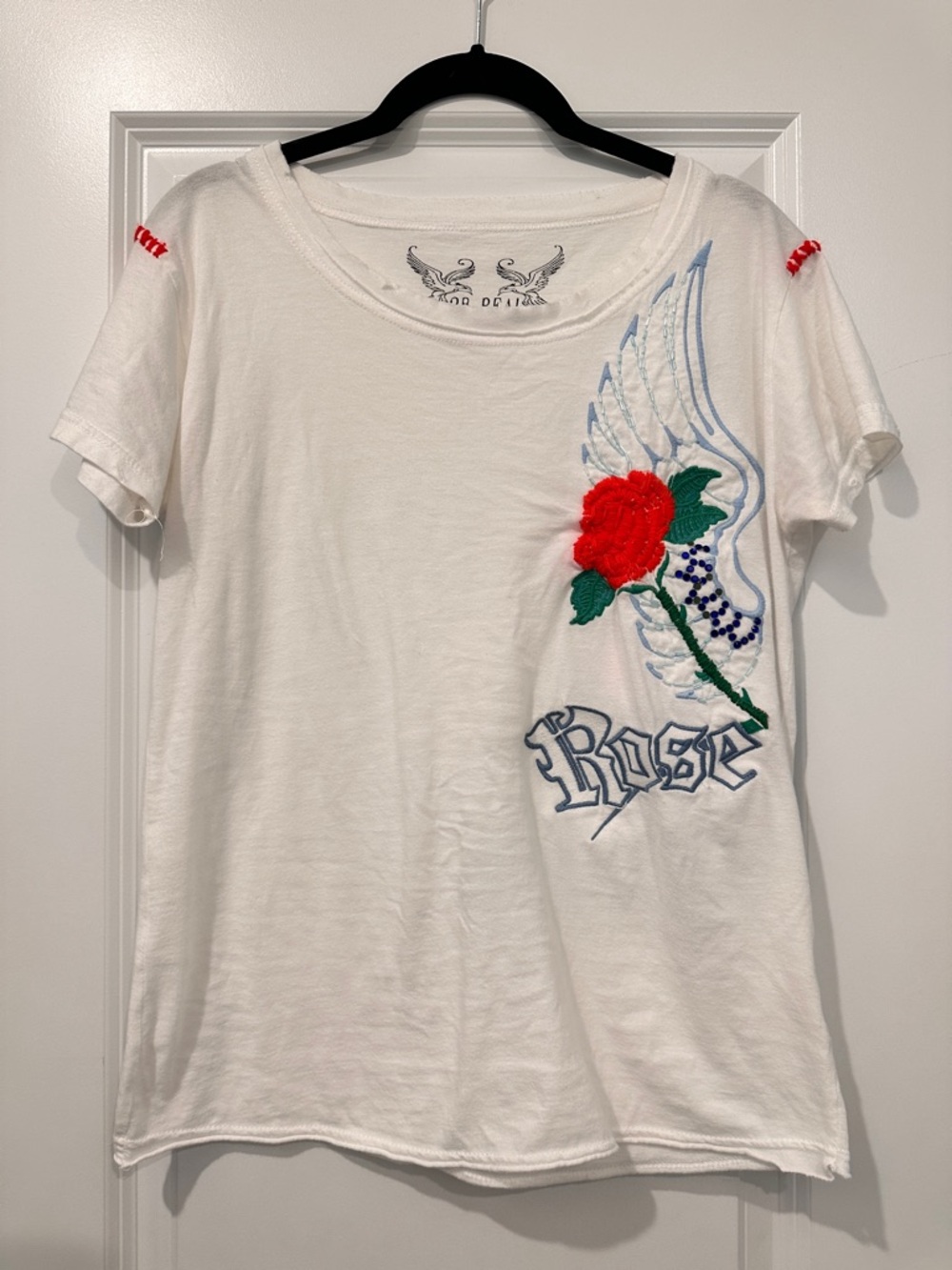 White Tee with Embroidered Red Rose and Angel Wing Graphic